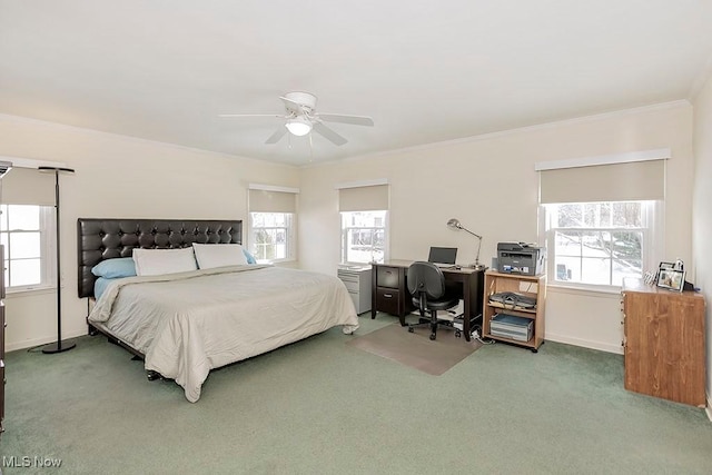 bedroom with baseboards, multiple windows, carpet, and crown molding