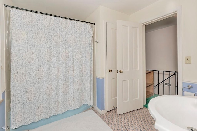 bathroom with tile patterned floors
