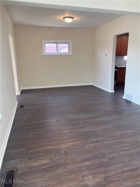 366 Tenney Ave, Campbell, OH 44405 - empty room with visible vents, baseboards, and dark wood finished floors