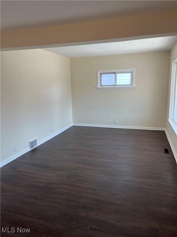 366 Tenney Ave, Campbell, OH 44405 - unfurnished room featuring visible vents, baseboards, and dark wood-style flooring