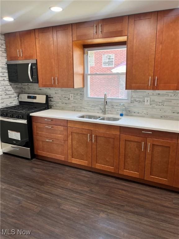 366 Tenney Ave, Campbell, OH 44405 - kitchen with a sink, dark wood finished floors, tasteful backsplash, and stainless steel appliances
