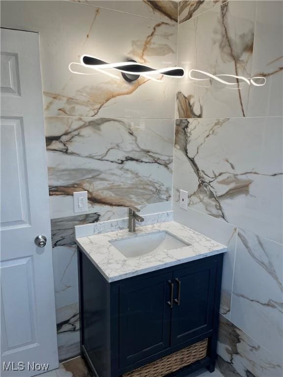 366 Tenney Ave, Campbell, OH 44405 - bathroom featuring stone wall, tile walls, and vanity