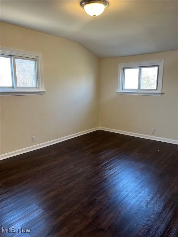 366 Tenney Ave, Campbell, OH 44405 - spare room with dark wood finished floors, lofted ceiling, and baseboards
