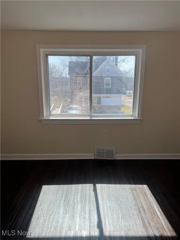 366 Tenney Ave, Campbell, OH 44405 - empty room with visible vents, baseboards, and wood finished floors
