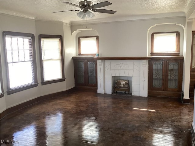 3370 E 145th St, Cleveland, OH 44120 - unfurnished living room with baseboards, a textured ceiling, ceiling fan, and hardwood / wood-style flooring