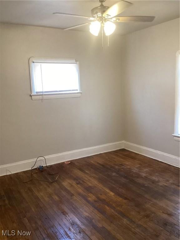 3370 E 145th St, Cleveland, OH 44120 - spare room featuring dark wood finished floors, baseboards, and a ceiling fan