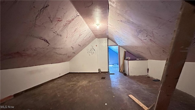 bonus room featuring vaulted ceiling