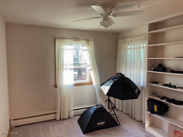 1317 Hartzell, Niles, OH 44446 - exercise room featuring a baseboard radiator, a ceiling fan, and carpet flooring