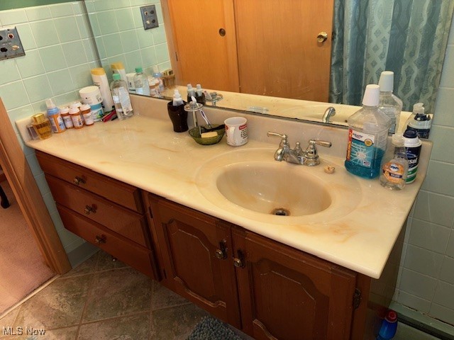 1317 Hartzell, Niles, OH 44446 - bathroom featuring tile patterned flooring, vanity, and tile walls