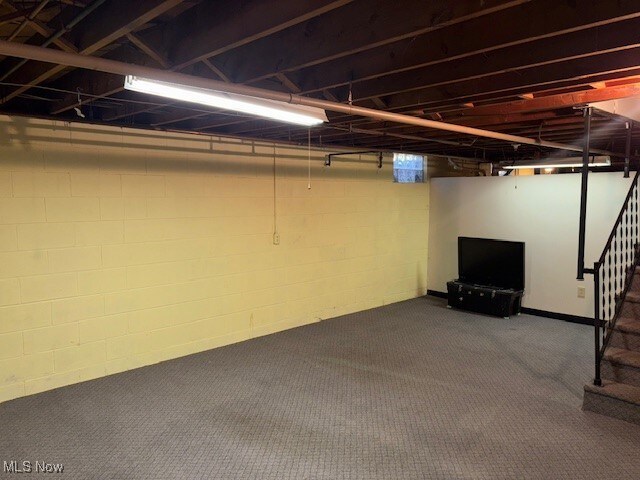 1317 Hartzell, Niles, OH 44446 - finished basement featuring stairway and dark carpet