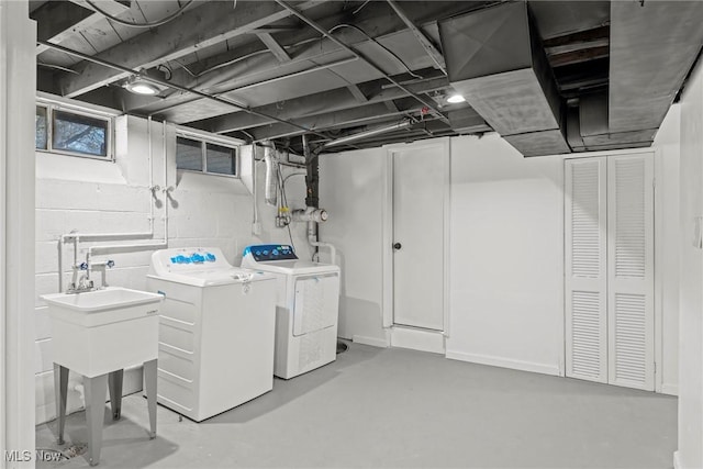basement featuring washing machine and clothes dryer