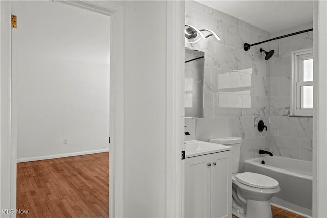 full bathroom with toilet, vanity, wood finished floors, and shower / bathtub combination