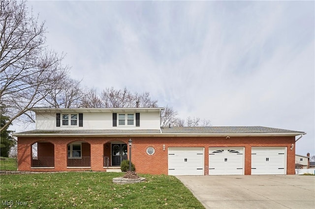 traditional-style home featuring brick siding, concrete driveway, a front yard, covered porch, and a garage