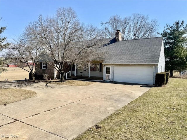 ranch-style house featuring concrete driveway, an attached garage, a front yard, and a chimney