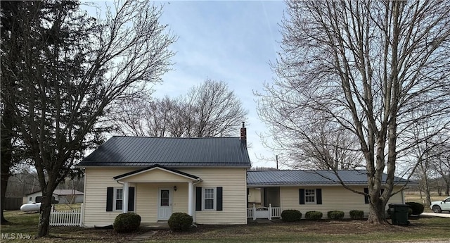 16535 State Route 60 S, Dresden, OH 43821 - view of front facade featuring a chimney, metal roof, and fence