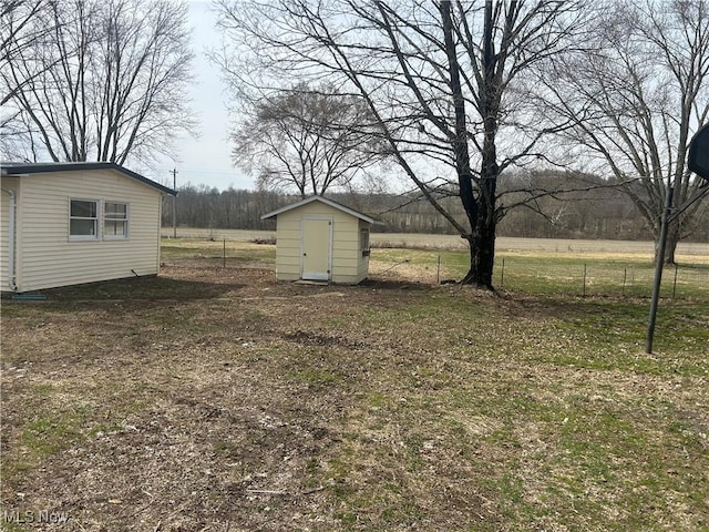16535 State Route 60 S, Dresden, OH 43821 - view of yard with a storage shed, an outdoor structure, and fence