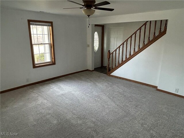 16535 State Route 60 S, Dresden, OH 43821 - carpeted foyer entrance with stairway, baseboards, and a ceiling fan