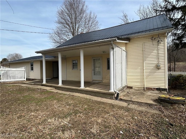 16535 State Route 60 S, Dresden, OH 43821 - rear view of house featuring metal roof, a patio, and fence