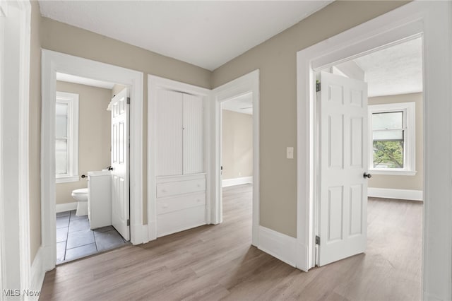 1344 E 112th St, Cleveland, OH 44106 - hallway with light wood-type flooring and baseboards