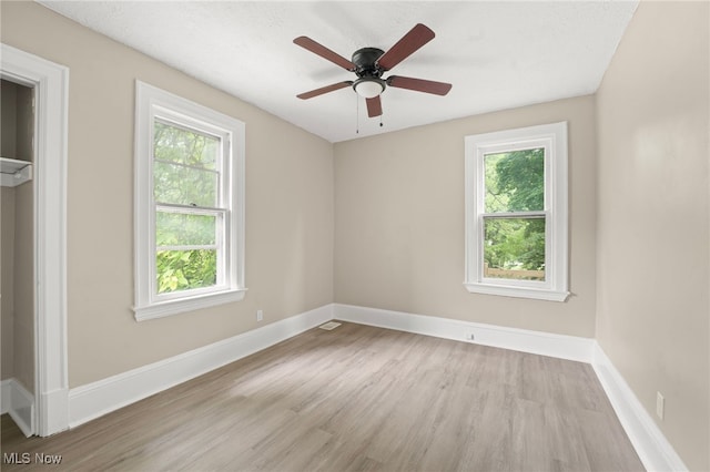 1344 E 112th St, Cleveland, OH 44106 - spare room featuring wood finished floors, baseboards, and ceiling fan