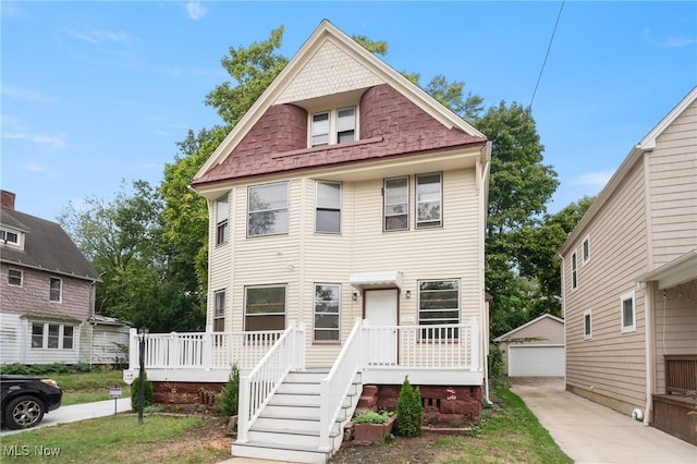 1344 E 112th St, Cleveland, OH 44106 - victorian-style house featuring an outbuilding and a detached garage