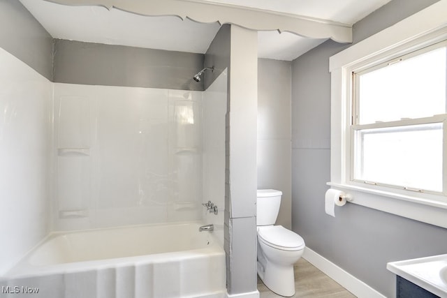 323 Belden Ave NE, Canton, OH 44704 - full bathroom with vanity, wood finished floors, baseboards, bathing tub / shower combination, and toilet