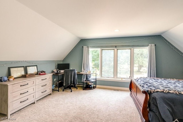 1581 E 118th St, Cleveland, OH 44106 - bedroom featuring vaulted ceiling, baseboards, and light carpet