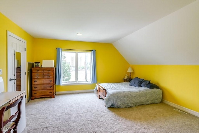 1581 E 118th St, Cleveland, OH 44106 - carpeted bedroom featuring visible vents, baseboards, and vaulted ceiling
