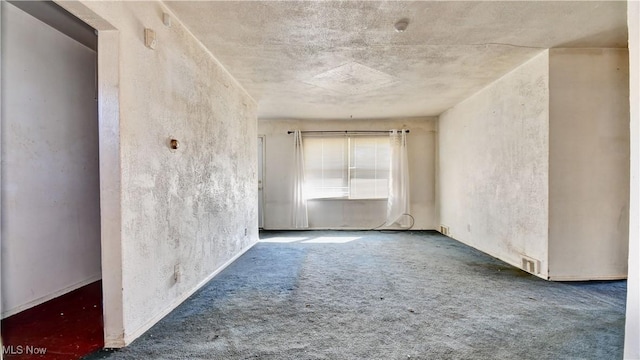unfurnished room with carpet and visible vents