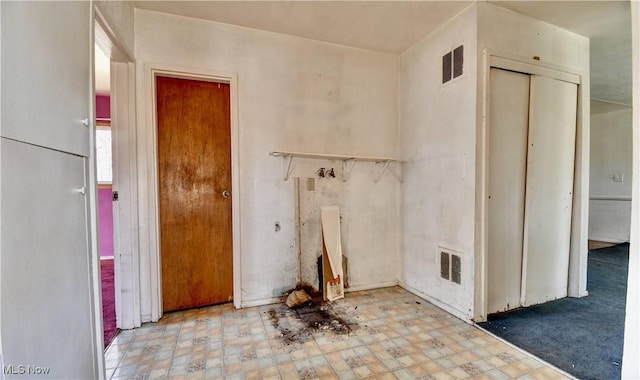 spare room featuring tile patterned floors and visible vents