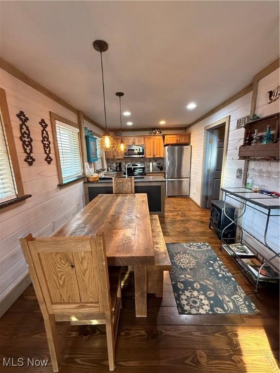 16223 Wooly Bear Ln, Kimbolton, OH 43749 - dining space with dark wood finished floors and wood walls