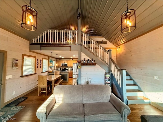 16223 Wooly Bear Ln, Kimbolton, OH 43749 - living room featuring stairway, dark wood-type flooring, wood walls, wood ceiling, and baseboards
