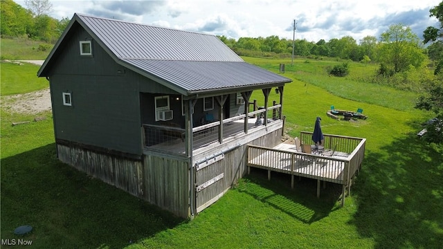 16223 Wooly Bear Ln, Kimbolton, OH 43749 - back of property with a yard, metal roof, a deck, and cooling unit