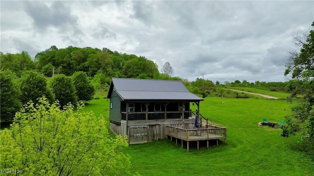 16223 Wooly Bear Ln, Kimbolton, OH 43749 - rear view of property with a lawn and metal roof