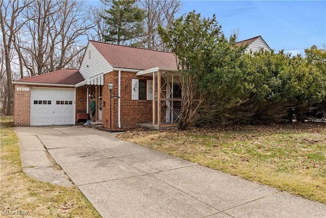 view of front of house featuring a garage, brick siding, concrete driveway, and a shingled roof