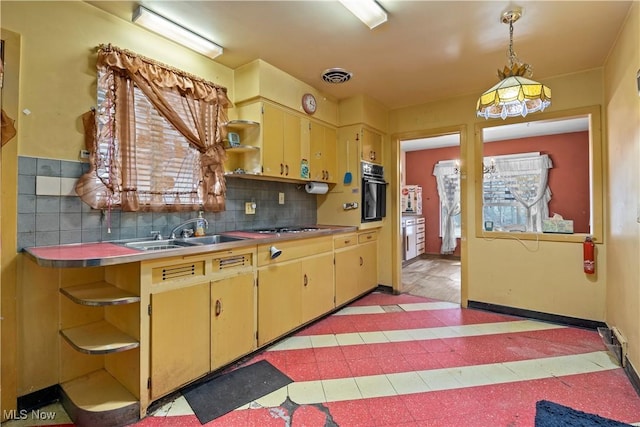 kitchen featuring a sink, open shelves, black oven, tasteful backsplash, and light floors
