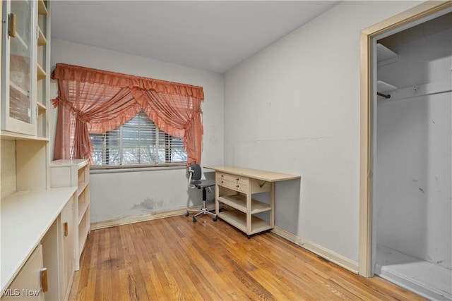 unfurnished office featuring hardwood / wood-style floors