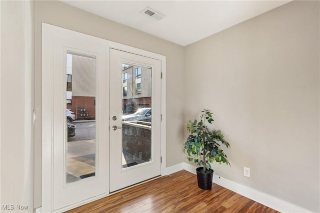 1228 W 74th St, Cleveland, OH 44102 - doorway with visible vents, baseboards, wood finished floors, and french doors