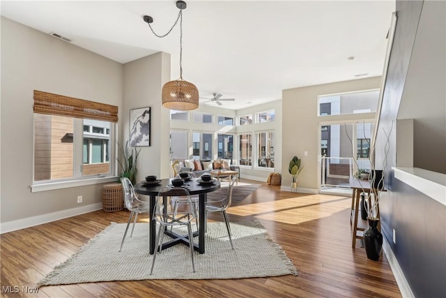 1228 W 74th St, Cleveland, OH 44102 - dining area featuring visible vents, wood-type flooring, baseboards, and ceiling fan