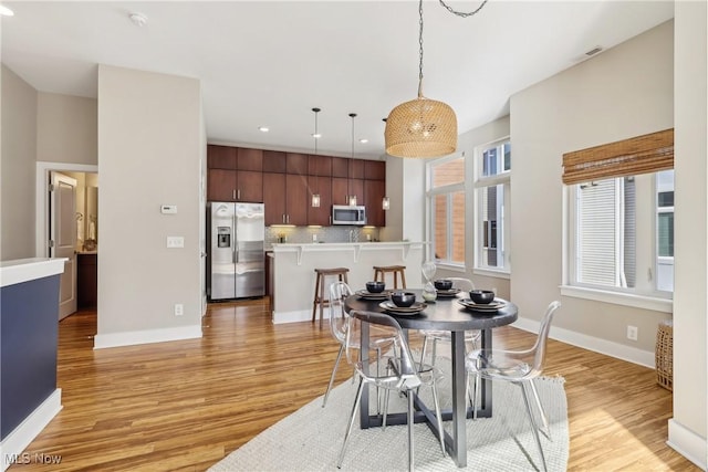 1228 W 74th St, Cleveland, OH 44102 - dining room with recessed lighting, light wood-style floors, and baseboards