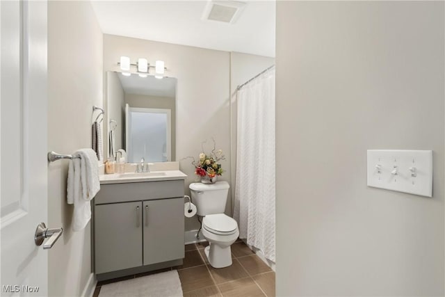 1228 W 74th St, Cleveland, OH 44102 - bathroom with curtained shower, toilet, vanity, and tile patterned flooring