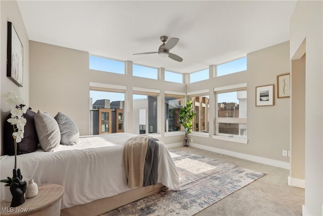 1228 W 74th St, Cleveland, OH 44102 - carpeted bedroom featuring baseboards and a ceiling fan