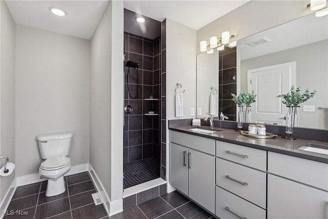1228 W 74th St, Cleveland, OH 44102 - full bath featuring toilet, a sink, tiled shower, double vanity, and baseboards