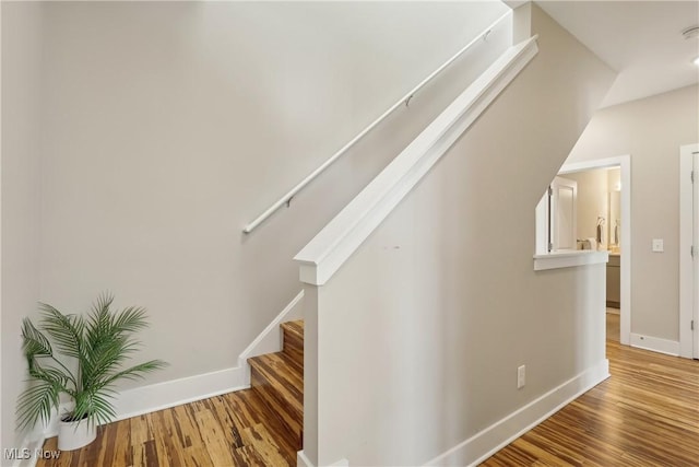 1228 W 74th St, Cleveland, OH 44102 - staircase featuring baseboards and wood finished floors