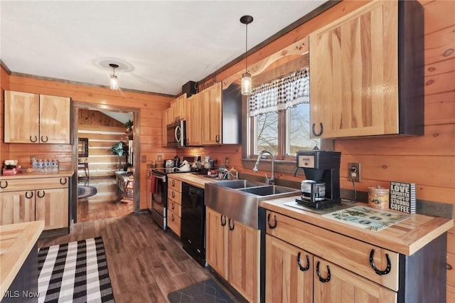 1525 Old Kyle Rd, Dorset, OH 44032 - kitchen with wooden walls, light brown cabinets, a sink, stainless steel appliances, and butcher block counters