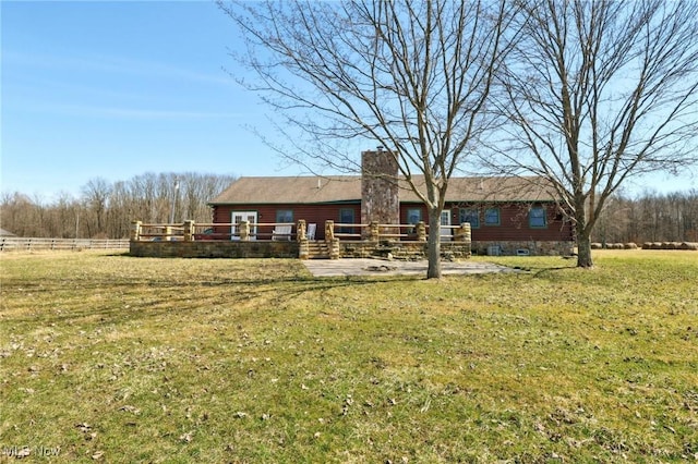 1525 Old Kyle Rd, Dorset, OH 44032 - back of property featuring a wooden deck, a yard, and a chimney