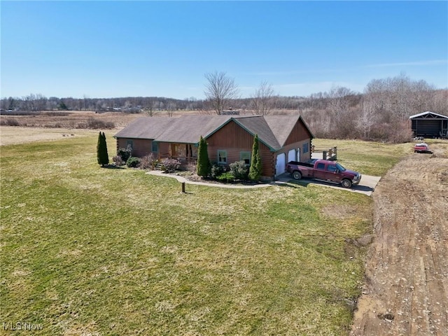 1525 Old Kyle Rd, Dorset, OH 44032 - view of front of house featuring a garage, driveway, and a front yard