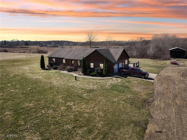 1525 Old Kyle Rd, Dorset, OH 44032 - view of front facade with a lawn, a garage, driveway, and roof with shingles
