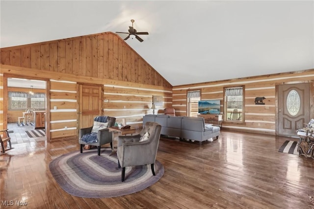 1525 Old Kyle Rd, Dorset, OH 44032 - living room featuring wood finished floors, a ceiling fan, wood walls, and high vaulted ceiling