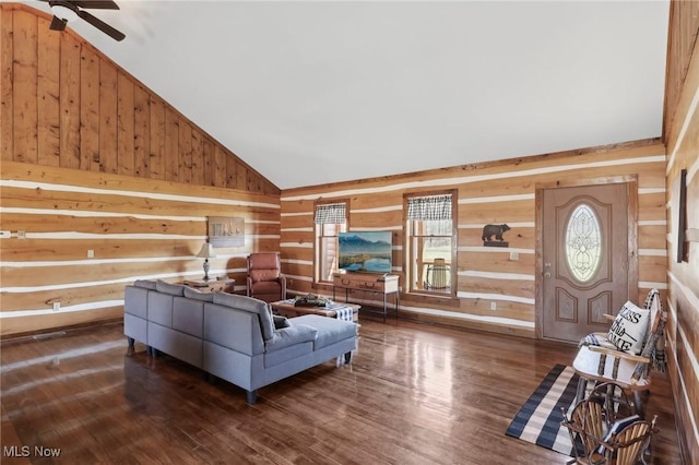 1525 Old Kyle Rd, Dorset, OH 44032 - living area featuring a ceiling fan, lofted ceiling, wooden walls, and wood finished floors